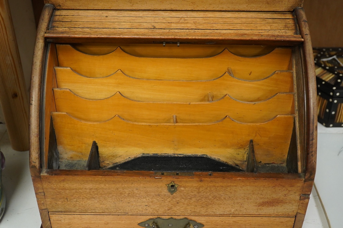 A Victorian mahogany stationery box with calendar and roll top, 34cm high